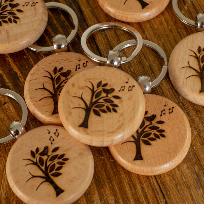 Round Wooden Keyring Laser Engraved with the Climate Choir Logo